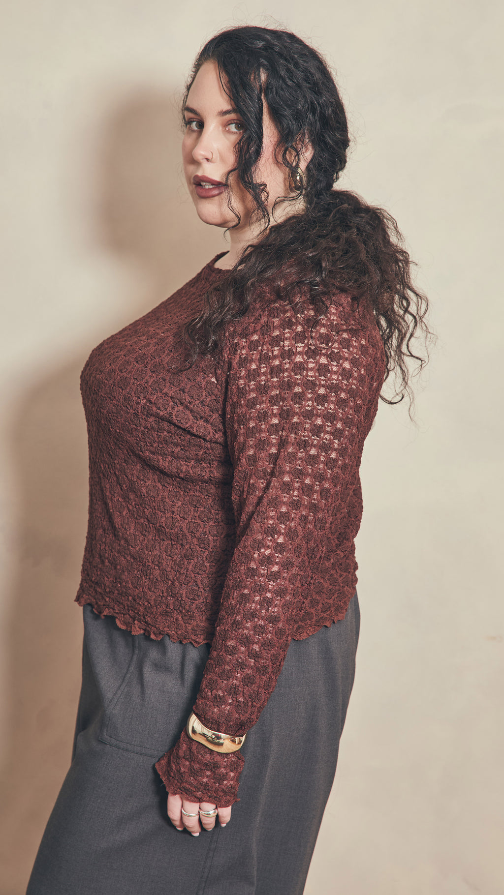 Side view of chocolate lace top