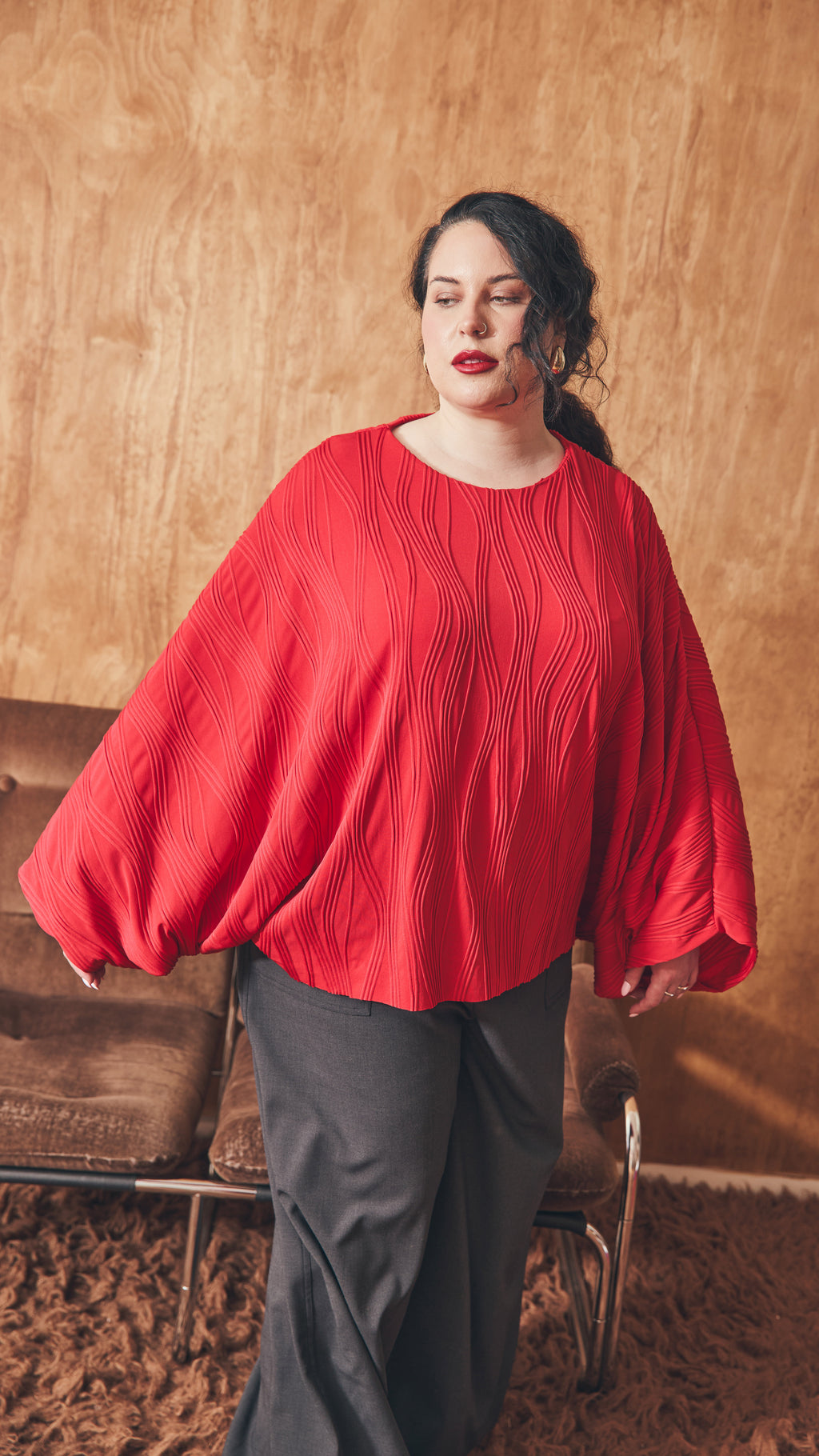 Modal moving shows drape of the dolman top.